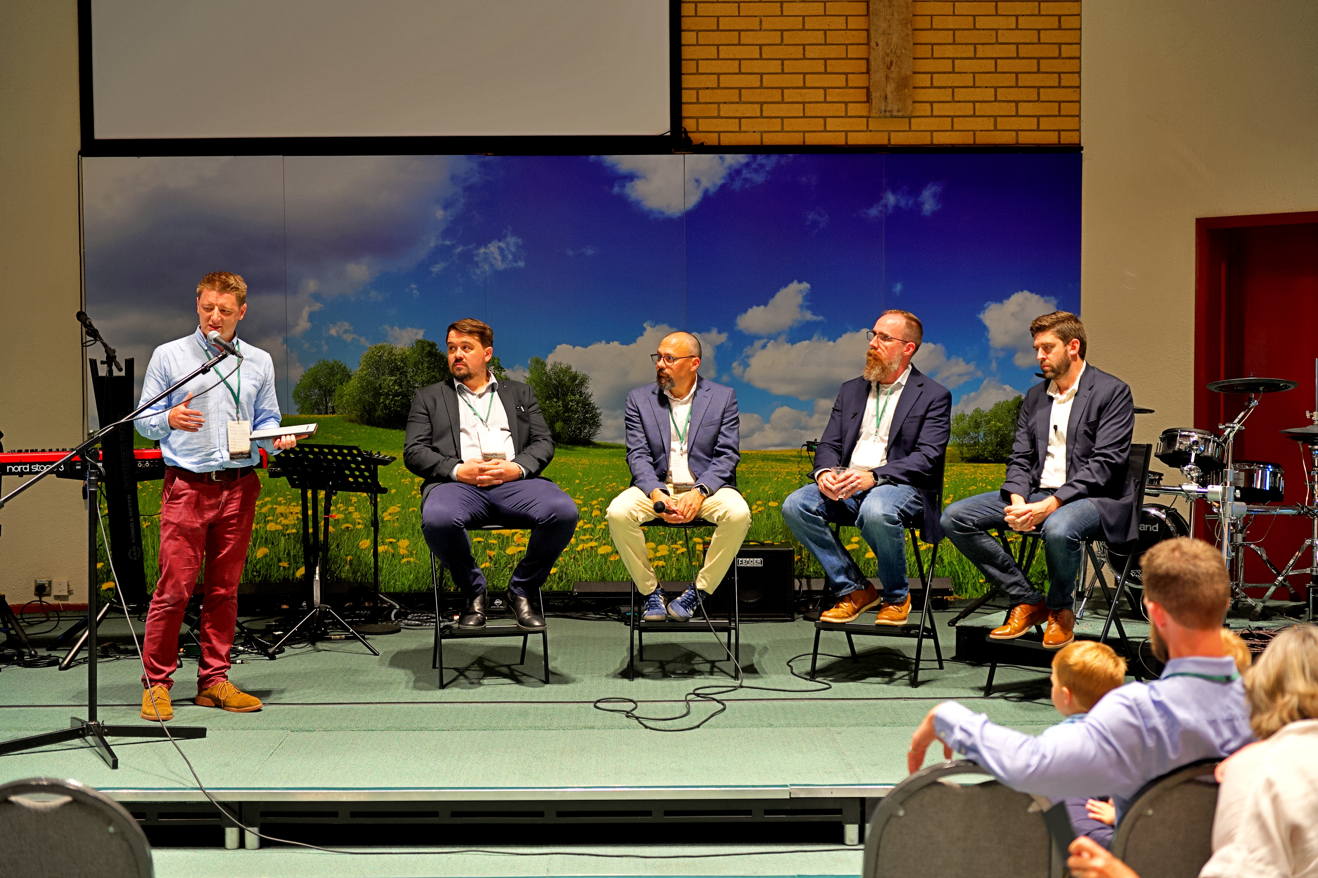 Speakers on the platform at the first conference